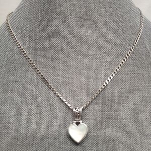 925 SX Stamped Reversible Sterling Silver Heart Pendant With Mother Of Pearl.